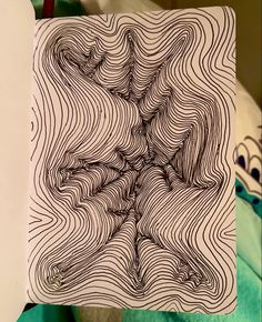 a drawing on a piece of paper with lines in the shape of a tree trunk