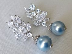 Wedding Light Blue Blush Baby Blue Pearl Cubic Zirconia Silver Statement Bridal Earrings. PLEASE READ ITEM DESCRIPTION and SHOP POLICIES before placing your order, and contact me with any questions! EARRINGS are about 1.33 inch (3.4cm) long from top of ear stud to bottom. MATCHING NECKLACE: https://www.etsy.com/listing/1259614370/blue-pearl-wedding-necklace-light-blue?click_key=b55f17ad702b9ccdc5acf299c5720deded066f95%3A1259614370&click_sum=0fe5bcb2&ref=shop_home_active_18&crt=1&sts=1 BRIDAL EAR Blue Pearl Drop Earrings For Anniversary, Anniversary Blue Pearl Drop Earrings, Blue Bridal Earrings For Formal Occasions, Blue Pearl Drop Wedding Jewelry, Blue Pearl Drop Jewelry For Wedding, Blue Cubic Zirconia Bridal Earrings For Wedding, Elegant Blue Bridal Earrings For Anniversary, Blue Pearl Drop Bridal Earrings As Gift, Elegant Blue Pearl Earrings For Anniversary