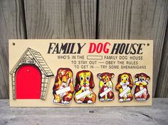 a family dog house sign on the floor