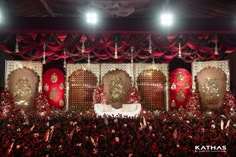 the stage is decorated with red and gold decorations