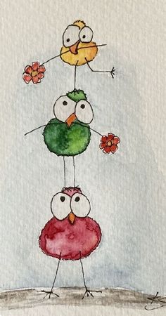 three birds are standing on top of each other with flowers in the air above them