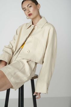 If you are looking for a truly unique jacket to wear formal and casual, then the June Jacket in Beige might be the perfect choice. The cropped jacket has a with a relaxed fit and voluminous sleeves with buttoned cuffs. It features tree functional large sized buttons in the front, a wide collar and side slit pockets. The June Jacket pairs well with our matching Bièl shorts, your favorite dresses and high waist pants. You can wear it as a blazer or jacket. The outer fabric is made from 100% dead stock linen and the inside is fully lined. The production is carried out by a family-owned business in Portugal.Size & FitFits true to size. Our model is 177cm (5 feet 9.7 inches) and wears size S. Materials & CareThe fabric of the June Jacket is made from 100% deadstock linen. The inside body lining Cropped Jacket Outfit Casual, Cropped Jacket Outfit, Outer Linen, Linen Jackets Women, Outfit Outer, Boxy Jacket, Boss Woman, Summer 25, Unique Jackets