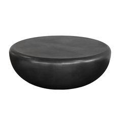 a black round table sitting on top of a white floor