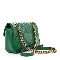 This is an authentic GUCCI Calfskin Matelasse Mini GG Marmont Shoulder Bag in Emerald Green. This shoulder bag is crafted of smooth and supple calfskin leather in green. This bag features an aged gold chain and leather shoulder strap. The front flap features an interlocking GG logo and opens to a beige suede interior with a zipper pocket. Gg Logo, Gg Marmont, Light Beige, Emerald Green, Gold Chain, Gold Chains, Patch Pocket, Calf Skin, Zipper Pocket