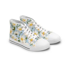 Daisy Floral Print High-Top Sneakers - Elevate your style with these colorful, versatile and stylish woman's shoes. Crafted with breathable polyester canvas and enhanced with hi-poly deodorant memory foam insoles, these women's high-top sneakers epitomize exceptional footwear. Available with either black or white soles and laces, they feature elegant silver metal eyelets and a secure lace-up closure. Customize your designs to create a unique, bespoke fashion statement. Breathable polyester canvas with PU leather accents Hi-poly deodorant memory foam insoles EVA shock-absorbing insole Full wraparound print (left side, right side, tongue) Durable rubber outsole Choice of black or white detailing Ankle-high Sneakers With Rubber Sole For Spring, White Breathable Canvas Shoes For Summer, Casual Ankle-high Sneakers For Spring, Spring Canvas Sneakers With Round Toe, Trendy Fabric Sneakers With Round Toe, Summer High-top Sports Sneakers, Summer High-top Sneakers For Sports, Breathable Canvas Shoes For Spring, Trendy High-top Fabric Sneakers