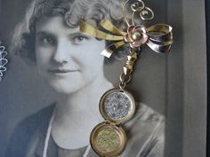 "A 1930's antique gold filled etched locket and floral bow brooch. The locket is etched with beautiful flowers and the initials \"JG\". It measures 7/8'' in diameter. The floral bow brooch measures 2 1/4'' x over 1 1/2''. It can be worn separate from the locket. The entire piece measures over 3'' x 2 1/4''. In good condition with some signs of wear to the gold on the brooch. May just need a real good polish." Antique Medallion Brooch For Wedding, Vintage Medallion Brooches For Wedding, Antique Wedding Brooches, Vintage Medallion Brooch For Wedding, Gold Locket Brooches For Gifts, Antique Brooches With Vintage Charm For Gifts, Antique Locket Brooch For Wedding, Antique Brooches With Vintage Charm As Gift, Heirloom Bronze Locket Jewelry