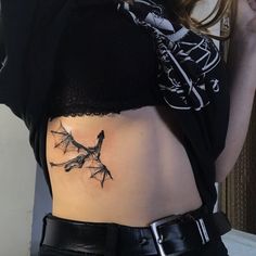 a woman with a tattoo on her stomach