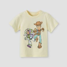 During fun-filled days at home or outdoors, your little guy will love sporting this Toy Story Short-Sleeve T-Shirt. Soft to the touch for comfy wear, this crewneck tee makes a great pick for the warmer months. He can also layer it under his zip-up hoodies and jackets, or above his long-sleeve tees for cozy warmth when the temps dip. The illustration on the front showcases Woody and Buzz Lightyear marching on a light yellow background, allowing him to flaunt his fandom when pairing it with a vari Toy Story First Birthday, Toddler Boy Toys, Disney With A Toddler, Disney 2024, Toy Story Shirt, Disney Toddler, Diy Disney, Disney Things, Comfy Wear