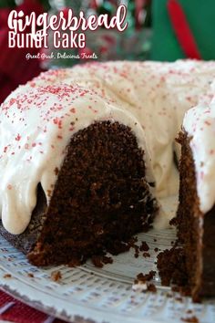 a chocolate cake with white frosting and sprinkles