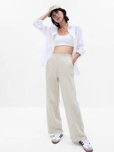 Soft fleece knit wide-leg sweatpants.  Elasticized waist.  Front slant pockets.  Seam at front.  #729444 Mid rise.  Straight silhouette with a relaxed fit.  Wide leg.  Models wearing Gap Cheap Relaxed Fit Cotton Sweatpants, Cheap Trendy White Cargo Pants, Cheap White Wide Leg Loungewear Pants, Cheap High Waist Sweatpants For Women, Affordable High Waist Trendy Sweatpants, Basic Cheap Sweats For Fall, Cheap Wide Leg Athleisure Activewear, Cheap Non-stretch High Waist Sweatpants, Cheap Stretch Sweatpants For Leisure