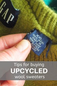 someone is holding up a sweater with the tag saying tips for buying upcycled wool sweaters