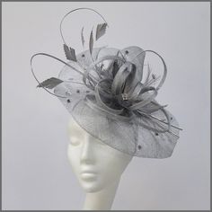 Unstructured sinamay disc in metallic silver. A versatile fascinator with sinamay loops, cut feathers, curled ostrich quills and scattered silver diamantés. Made on a headband. Please note this design is made to order, orders take approximately 2-3 weeks to be made. This design is available in other colours on request. All of our designs can be made to order in a range of different colours or styles, see our colour chart: https://jacquivaledesigns.co.uk/pages/sinamay-colour-chart Please contact Mini Hats, Wedding Fascinators, Derby Day, Turban Style, Brooch Bouquet, Grand National, Royal Ascot, How To Preserve Flowers, Race Day