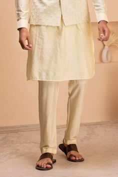 Lemon yellow sleeveless bundi with all over Gulshan bloom embroidery. Paired with a full sleeves kurta and an Aligadhi pant. - Aza Fashions Spring Fitted Dabka Sherwani, Traditional Spring Nehru Jacket With Dabka, Traditional Sherwani With Pallu For Spring, Yellow Nehru Jacket For Festive Spring Occasions, Yellow Nehru Jacket For Spring Festivals, Festive Yellow Nehru Jacket For Spring, Traditional Naqshi Wear For Spring, Traditional Wear Naqshi For Spring, Bloom Embroidery