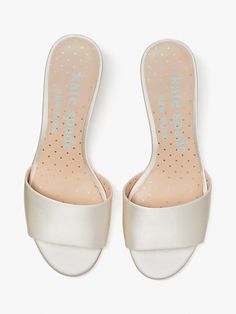 For the bride-to-be: Toss the bouquet in that magical white dress and these slide sandals, featuring a snow globe heel with a wedding cake for the occasion... | Kate Spade Love Slide Sandals, Ivory Bridal Ivory Bridal, Sheep Leather, Snow Globe, Kate Spade New York, Low Heels, Slide Sandals, Wedding Events, Wedding Cake, Snow Globes