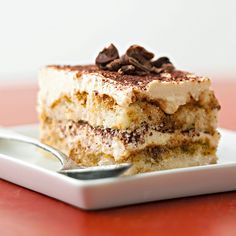 a piece of cake sitting on top of a white plate with a fork in it