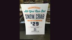 a sign advertising snow crab in a store