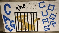 a sign that says the caged bear with a teddy bear in it's cage