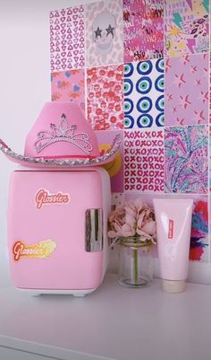 a pink ice cream machine sitting on top of a counter