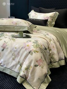 the comforter is made up with flowers on it