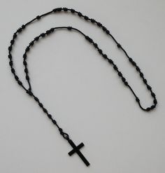 "SIZE/LENGTH: 18\" long including the Cross Great to use as a necklace rosary. MATERIAL: Made with strong nylon cord. Knot size is approx. 1/4\" CORD THICKNESS: 2 mm (Approx. 1/16\") CROSS: Black enamel Cross measures 1-7/8\" x 1-1/8\" - MADE IN ITALY - Every corded rosary that we sell comes with a FREE beautiful velveteen pouch. This is a very economic, good quality and elegant rosary that you can take anywhere. It will last a long time. To prevent from getting damaged it's a good idea to prese Enamel Cross, Black Cross, The Cross, Black Enamel, Rosary, Knot, Pouch, Italy, Black