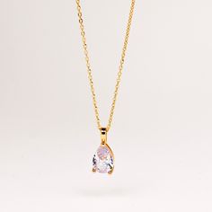 This timeless necklace features a stunning teardrop-shaped diamond pendant with dainty gold chain necklace. A delicate piece that is sure to catch eyes. Wear it on its own or layer with your other favorite necklaces and pendants. ∙DETAILS Diamond: 11mm x 8mm CZ Diamond Chain: 16'' + 2'' Made of 925 Sterling Silver Plated with 18K Gold Waterproof & hypoallergenic ∙ Free Diamond Eternity Ring will be automatically packed to eligible orders until 22nd of May. You don't have to add Eternity Ring to Elegant Teardrop Solitaire Necklace With Delicate Chain, Elegant Rose Gold Teardrop Pendant Drop Necklace, Gold Solitaire Teardrop Pendant Necklace For Formal Occasions, Gold Teardrop Pendant Solitaire Necklace For Formal Occasions, Gold Solitaire Necklace With Teardrop Pendant For Formal Occasions, Dainty Pear-shaped Drop Necklace For Formal Events, Elegant Teardrop Solitaire Necklace For Gift, Elegant Gold Solitaire Teardrop Necklace, Classic Rose Gold Teardrop Necklaces