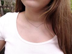 "A simple yet gorgeous everyday piece small wire heart sliding freely along on a delicate silver chain. Great for layering with other delicate necklaces or minimalist wear. Heart silver-tone bezel frame nickel and lead-free - measures about 9/16\"x 1/2\" (14x13 mm), comes with 16\" Hypoallergenic surgical steel chain or Sterling silver chain Each piece is handmade from real pressed flowers. Your design may vary slightly from the picture as each piece is one of a kind! Please keep from extreme mo Delicate Open Heart Charm Necklace With Delicate Chain, Dainty Open Heart Nickel Free Necklace, Cute Adjustable Heart Pendant Jewelry, Cute Everyday Heart Pendant Jewelry, Everyday Nickel Free Open Heart Necklace, Minimalist Double Heart Necklace For Mom, Minimalist Double Heart Necklace As Gift For Mom, Minimalist Double Heart Necklace Gift For Mom, Delicate Heart Necklace Gift For Mom