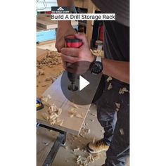 a man is using a drill to cut wood