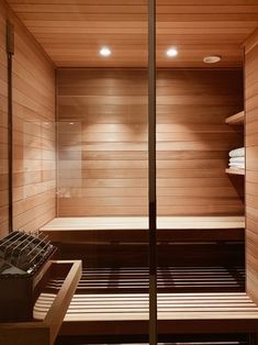 a sauna with two benches and towels in it