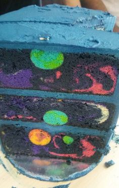 there is a piece of cake that has been decorated with different colors and shapes on it