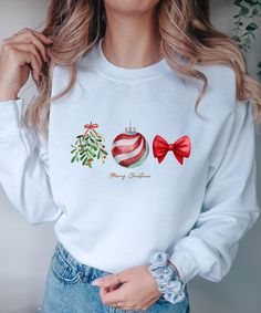 This sweatshirt is perfect for all Christmas lovers. Also as a gift for Christmas.  ♥ PRODUCTION TIME: 1-5 days (Usually 2-3 days) ♥ SHIPPING TIME: 2-5 days (Usually 3 days) ♥ PRODUCT DESCRIPTION: Gildan 18000 Made with a medium-heavy fabric blend of 50% cotton and 50% polyester (8.0 oz/yd² (271.25 g/m this sweatshirt feels cozy and is the perfect choice for those colder months. The classic fit along with the crew neckline deliver a comfy wearing experience with a clean-cut style. Meanwhile, the double-needle stitching at the shoulder, armhole, neck, waistband, and cuff seams add top-tier durability. Say goodbye to itchiness thanks to the gray, pearlized tear-away label. Made using 100% ethically grown US cotton. Gildan is also a proud member of the US Cotton Trust Protocol ensuring ethica Cute Holiday Crew Neck Sweatshirt, Cute Crew Neck Sweatshirt For Holiday, Cute White Christmas Sweatshirt, Cute White Christmas Sweater, Cute Winter Sweatshirt For Gift, Cute Winter Sweatshirt Gift, Cute Winter Holiday Sweatshirt, Cute Sweatshirt For Holiday Winter, White Winter Sweatshirt Gift