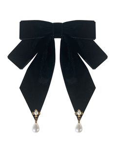 a pair of black velvet bows with pearls on the ends and an attached pearl drop