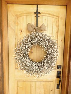 a door with a wreath and cross on it