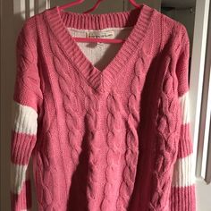 Poof Girl Excellence Long Sleeve V-Neck Cable Knit Sweater In Beautiful Combination Of Pink And White. Stylishly Cut Out Triangle At The Back. Cable Net Sweater, Net Sweater, Cable Knit Sweater, Pink And White, Pullover Sweater, Kids Shirts, Cable Knit, Pullover Sweaters, Sweater Top