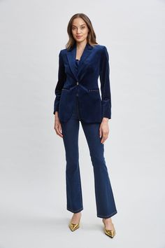 Borrowed from the boys but totally femme, our stretch Velvet Blazer is a must have. Sharp tailoring meets the lush touch and patina of velvet in our peaked lapel One Button Blazer. Designed with gold pocket detailing & button closure, think of velvet for day and night and mix it with denim, vegan leather and satin 24/7. Elie Tahari Exclusive Single Button Velvet Blazer with Peak Lapels & Gold Detailing 97% Cotton; 3% Elastane Runs true to size. Model is 5'9" and wearing size 2 Length From Should Luxury Velvet Blazer For Work, Elegant Velvet Blazer With Button Closure, Elegant Velvet Outerwear With Buttons, Elegant Velvet Blazer With Buttons, Luxury Velvet Suit For Work, Luxury Velvet Suits For Workwear, Fitted Velvet Blazer With Button Closure, Chic Velvet Blazer With Notch Lapel, Fitted Velvet Blazer With Buttons