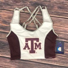 Nuyu Texas A&M Aggies University Sporty Cropped Tank Top Sports Bra New Womens Brand New With Tags Size Xs Pit To Pit 12" Size Small Pit To Pit 13" Size Medium Pit To Pit 14” Size Large Pit To Pit 15" Size Xl Pit To Pit 16" Collegiate White Activewear For Sports, White Racerback Top With Mesh Back, White Sportswear Top With Mesh Back, White Cotton Sports Crop Top, White Mesh Back Racerback Top, White Casual Crop Top For Gym, White Sporty Crop Top For Sports, White Cotton Sports Bra For Spring, Sporty White Crop Top For Sports