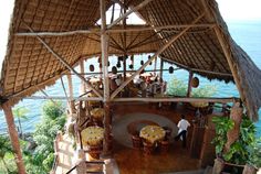 an outdoor dining area overlooking the ocean