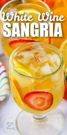 white wine sangria with sliced strawberries and oranges