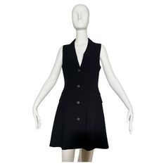 Black sleeveless blazer dress. Vest style. Lapel. Front pockets. Button closures. Lined. Wool. Made in Italy. *Condition: excellent vintage condition. No visible flaws. Measurements Taken Laying Flat (inches)— Shoulder to Shoulder: 13 in. Bust: 32 in. Waist: 30 in. Hip: 34 in. Length: 37 in. Marked size: 40 IT, 6 US— best fit for a 4/6 Sleeveless Fitted Blazer Dress With Buttons, Fitted Sleeveless Blazer Dress With Buttons, Elegant Sleeveless Dress With Button Closure For Work, Classic Tailored Jacket Dress With Buttons, Tailored Classic Jacket Dress With Buttons, Formal Sleeveless Buttoned Blazer Dress, Formal Sleeveless Blazer Dress With Buttons, Sleeveless Buttoned Blazer Dress For Formal Occasions, Formal Knee-length Sleeveless Dress With Buttons