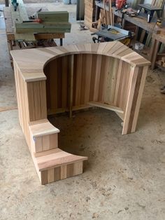 a wooden bench sitting inside of a shop