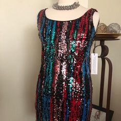 Are You Ready To Party! This Multi-Sequined Sheath Dress In Shades Of Red, Blue, Copper, Green And Black Will Surly Get You In The Mood. If You’re Not Shy, This Dress Is For You. - 32�” From Shoulder To Hem - Deep U Neckline In Front - V Neckline In Back - Polyester Lining - 13” Gold Zipper - Sleeveless - Dry Clean Only In The Mood, Calvin Klein Black, Green And Black, Gold Zipper, Shades Of Red, The Mood, Womens Calvin Klein, Sheath Dress, Red Blue