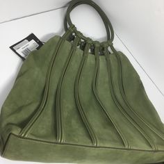 New With Tags! Excellent Condition! Soft “Leaf” Colored Suede Large Tote With Great Details Of Round Leather Handles And Leather Stripping Down The Bag On Front And Back. A Little Boho & Funky From The Luxe Designer.Bruno Magli, Famous For His Fine Leather Work. It Retails For $995. When It Was New. It’s Probably Worth More Now. Nonsmoking Home. Roomy Bag. Measurements Taken With Bag Lying Flat. Base Of Bag Is 16” X 4”. Width Of Bag Starts At 16”& Slowly Tapers Inward To 12” At Top. It Can Be Fo Elegant Suede Bag With Textured Leather, Elegant Green Hobo Bag With Double Handle, Luxury Suede Hobo Bag For Shopping, Elegant Green Hobo Shoulder Bag, Elegant Green Satchel Hobo Bag, Elegant Green Top Handle Hobo Bag, Green Leather Hobo Bag For Evening, Designer Suede Bags For Daily Use, Designer Suede Bags For Formal Occasions