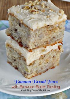 two pieces of banana bread bars with browned butter frosting on a white plate