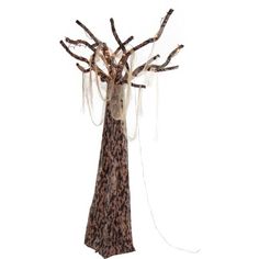 a tall tree with branches wrapped around it's trunk and hanging from the ceiling