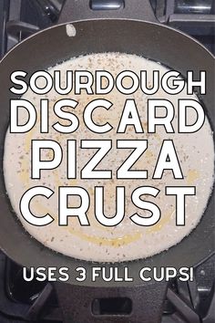 a pan with some food inside of it on top of a stove and the words sourdough discard pizza crust uses 3 full cups