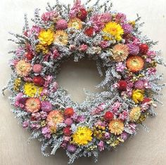 a wreath made out of flowers on a table