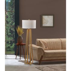 a living room scene with focus on the floor lamp and sofa in the foreground