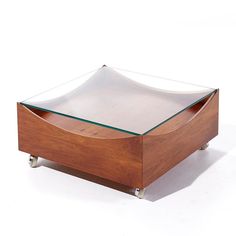 a wooden box with glass top on wheels