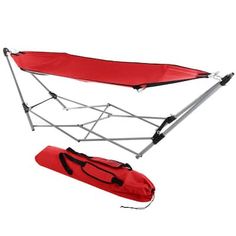 an image of a red portable hammock set up with straps and carry bag