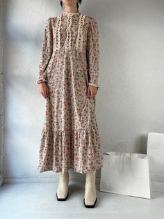 "- Vintage 90s floral print long sleeve dress - Feels like cotton - Stain on the inside of one of the sleeve ruffles - Metal zipper up the back - No tags - Small  Bust: 18\" Waist: 15\" Length: 49\"" Long Sleeve Ditsy Floral Dress For Spring, Spring Floral Long Sleeve Dress With Ruffles, Feminine Long Sleeve Floral Dress With Ruffles, Long Sleeve Floral Dress For Fall Garden Party, Long Sleeve Floral Dress For Garden Party In Fall, Spring Long Sleeve Prairie Dress With Ruffle Hem, Spring Casual Long Sleeve Prairie Dress, Casual Floral Long Sleeve Dress With Ruffle Hem, Casual Long Sleeve Floral Dress With Ruffle Hem