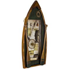 an old fashioned wooden boat with various items in it's display case on a white background